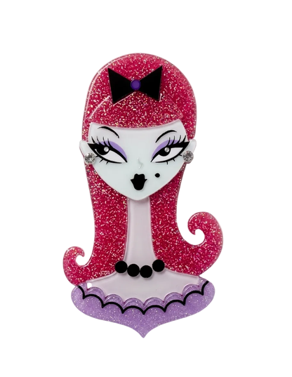 A Monster High themed enamel pin featuring the character Angelina, with glittery pink hair, a black bow, and a purple gothic dress on a white background.