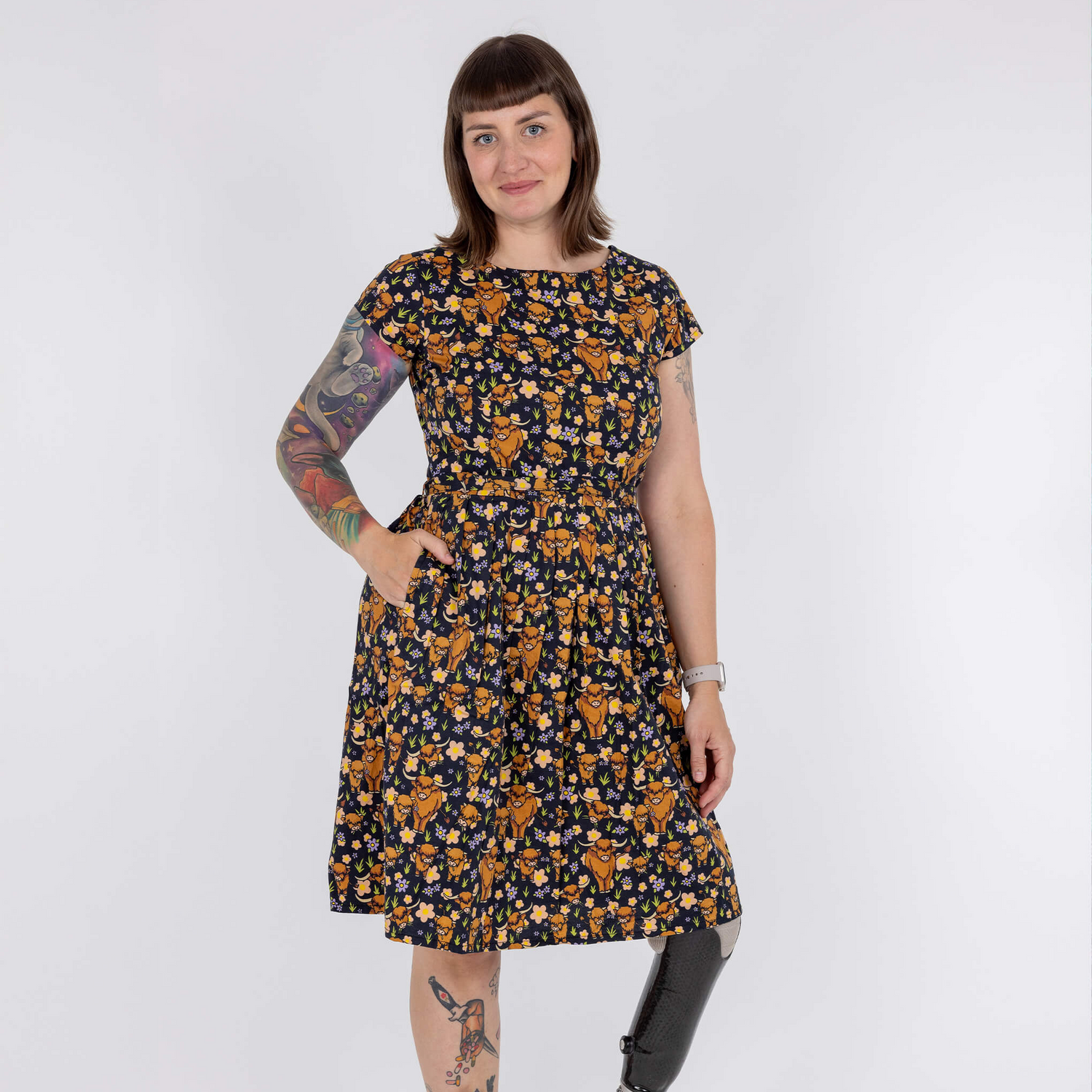 Woman wearing a floral dress with a white background