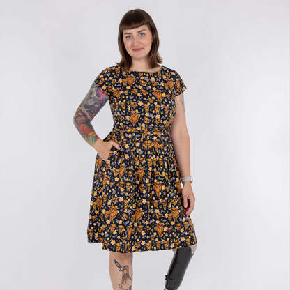 Woman wearing a floral dress with a white background