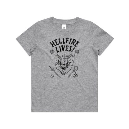 A close-up of a heather gray t-shirt featuring a black graphic print of a horned skull in a shield, surrounded by fantasy-themed icons including dice, a sword, and a mace, with the text 'HELLFIRE LIVES!'.