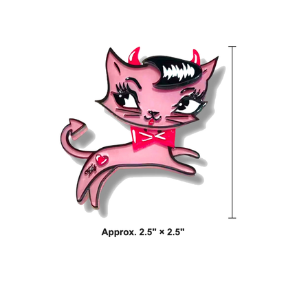 A pink cartoon cat enamel pin with devil horns, a red bow tie, and a heart on its side, shown on a white background with a height marker and size text reading 'Approx. 2.