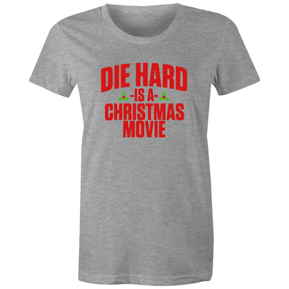 A black women's t-shirt with the text 'DIE HARD IS A CHRISTMAS MOVIE' printed in red and white.