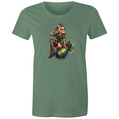 Women's green t-shirt with a vintage style pinup illustration of a female character sitting next to a bomb, on a maple green background.