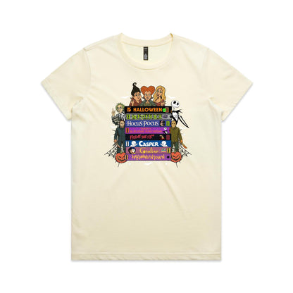 A graphic print featuring characters and movie titles from the Disney-Halloween franchise, including Holly, Jack Skellington, Michael, Sally, and Gus, arranged around stacked film title bars on a light beige background.