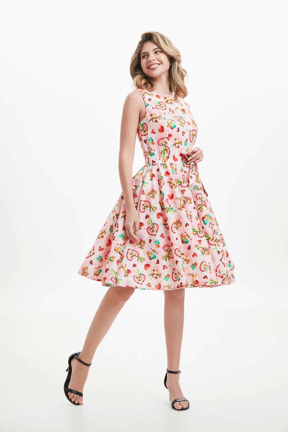 A woman wearing a knee-length sleeveless linen fit and flare dress with meerkat print pockets, a boat neckline, and an invisible zipper in the back. christmas dress xmas