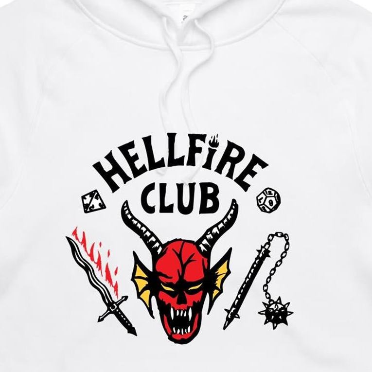 White pullover hoodie featuring a graphic print of a red horned devil face with the text 'HELLFIRE CLUB' in black above it, accompanied by a sword with red flames, a mace, and small black symbols.
