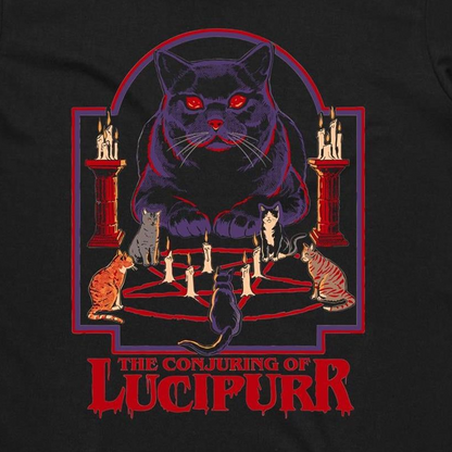 A black graphic print featuring a large purple cat with glowing red eyes sitting above a pentagram and candles, with smaller cats around it and the text 'THE CONJURING OF LUCIPURR' in red at the bottom.