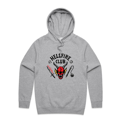 White pullover hoodie featuring a graphic print of a red horned devil face with the text 'HELLFIRE CLUB' in black above it, accompanied by a sword with red flames, a mace, and small black symbols.