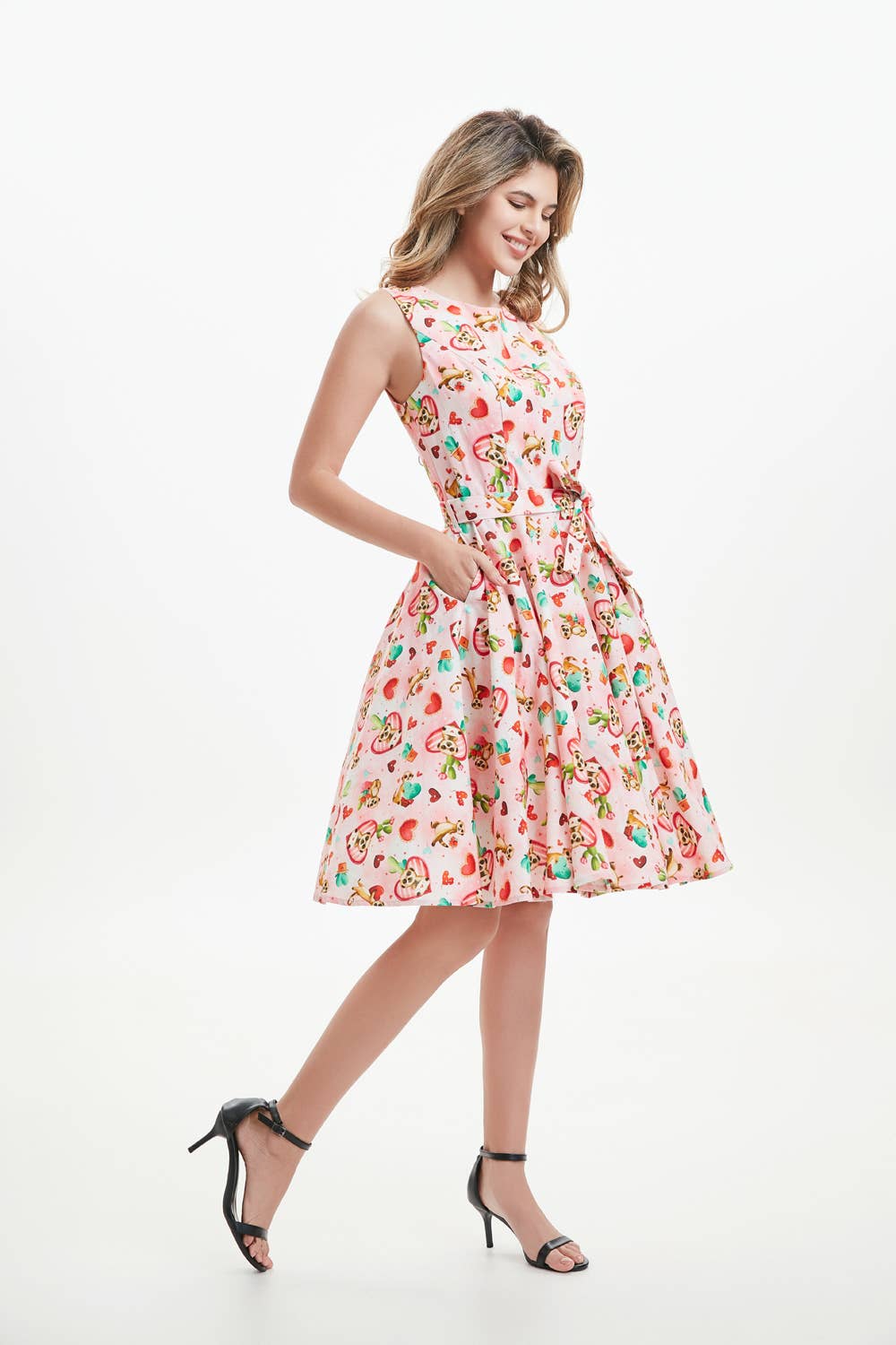 A woman wearing a knee-length sleeveless linen fit and flare dress with meerkat print pockets, a boat neckline, and an invisible zipper in the back. christmas dress xmas