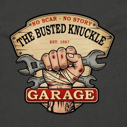 A graphic print on a dark charcoal t-shirt featuring a vintage-style sign that reads 'THE BUSTED KNUCKLE GARAGE' with a bandaged hand and crossed wrenches in the center.