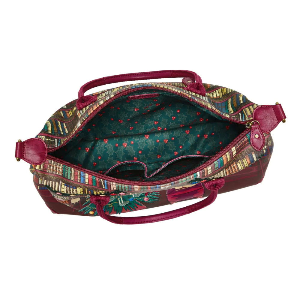 Open multicolored patterned bag with a green interior on a white background