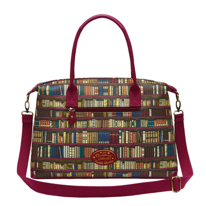 Handbag with bookshelf pattern and red straps on a white background