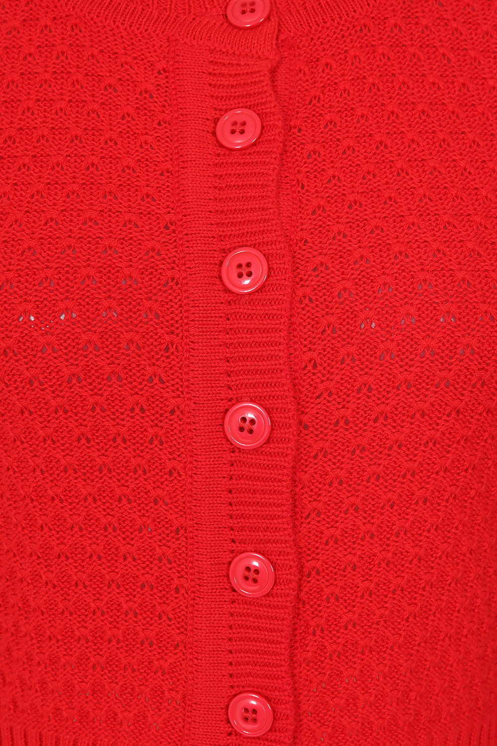 Close-up of a red textured fabric with buttons