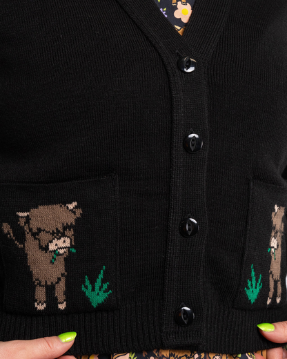 Black cardigan with cow designs on the pockets